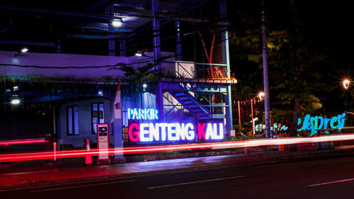 Light trails on road in city at night