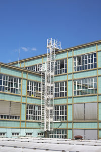 Low angle view of building against blue sky