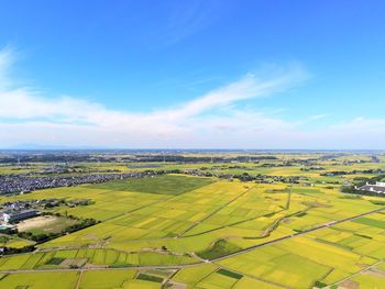 Aerial view of agricultural field against sky