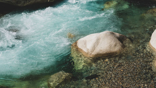 High angle view of rock in sea