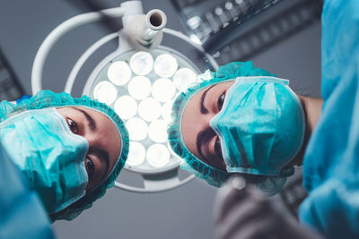 Directly below shot of surgeons at hospital