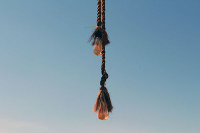 Low angle view of rope against clear sky