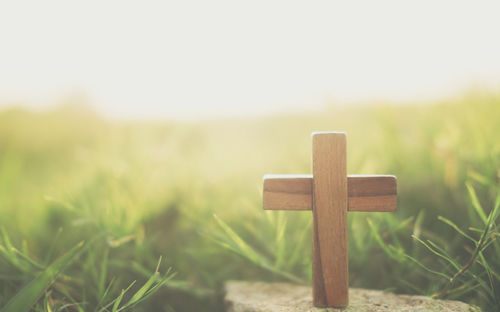 Close-up of cross on field