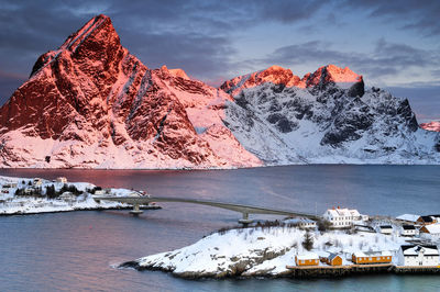 Snowy mountains in lofoten at sunrise