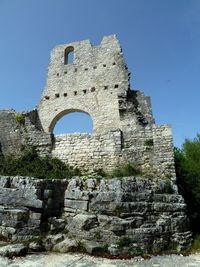 Low angle view of old ruin building against sky