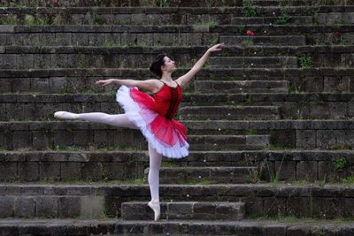 Full length of woman walking on staircase