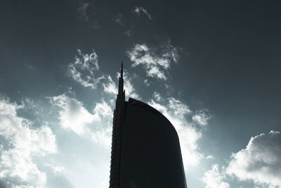 Low angle view of building against cloudy sky