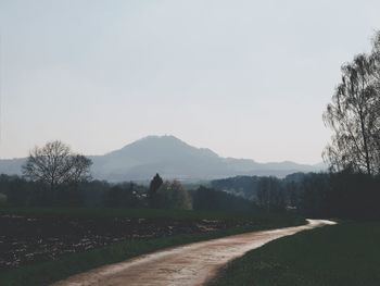 Scenic view of field against clear sky