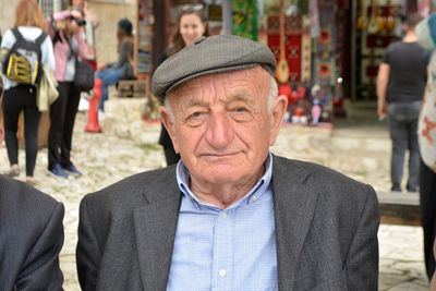 Close-up portrait of senior man wearing suit