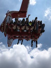 Low angle view of amusement park ride against sky