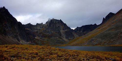 Scenic view of lake and mountains against sky