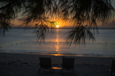 Scenic view of sea against romantic sky at sunset