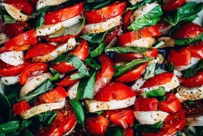 Fresh tomatoes staffed with basil and mozzarella