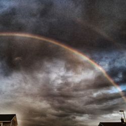 Low angle view of rainbow against sky