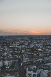 High angle view of city at sunset