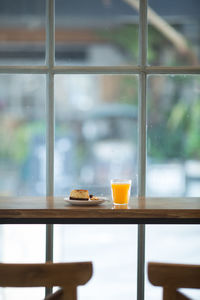 Glass of drink on table