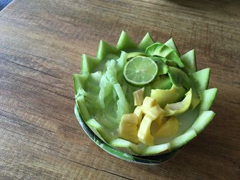 High angle view of chopped fruits in bowl on table