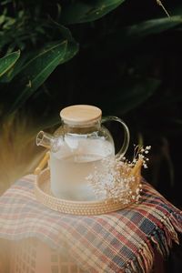 Close-up of glass jar on table