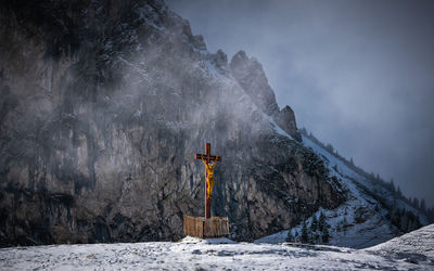 Scenic view of snowcapped mountains against sky during winter