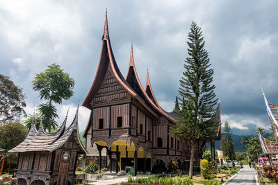 View of temple building against cloudy sky