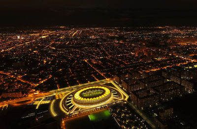 High angle view of illuminated buildings in city at night