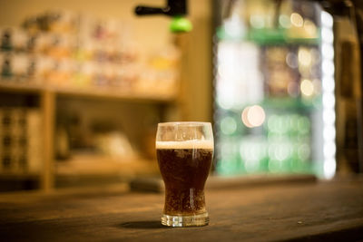 Close-up of beer glass on table