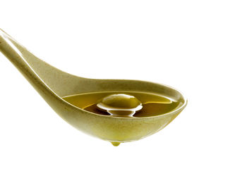 Close-up of ice cream in bowl against white background