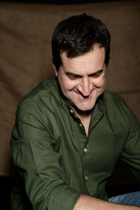 Close-up of man sitting outdoors