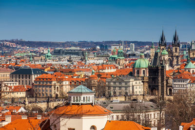 Charles bridge and prague city old town seen from petrin hill in a beautiful early spring day