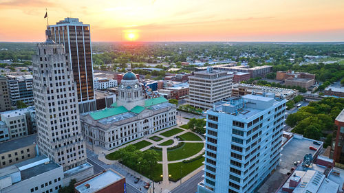 Cityscape against sky during sunset