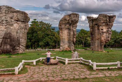 Woman sitting on old ruins