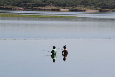 Men in lake