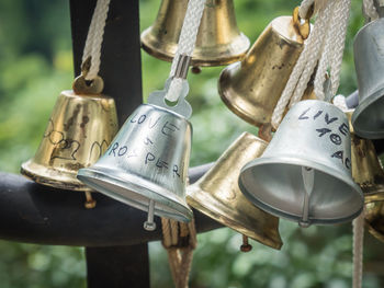 Close-up of padlocks hanging on metal