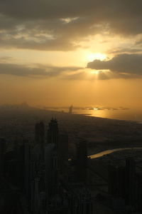 Aerial view of city at sunset