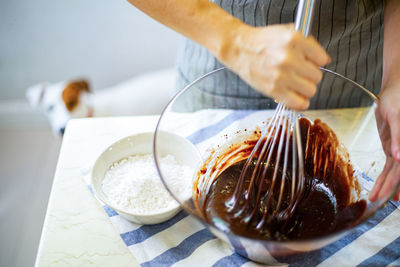 Midsection of man preparing food on table