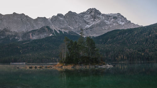 Scenic view of lake and mountains against sky