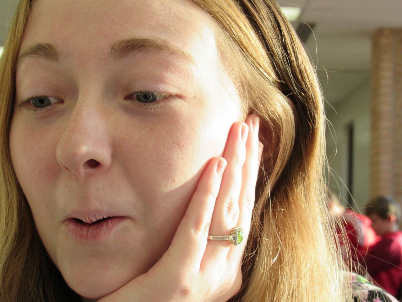 real people, one person, headshot, close-up, focus on foreground, lifestyles, young adult, day, indoors, young women, blond hair, tensed