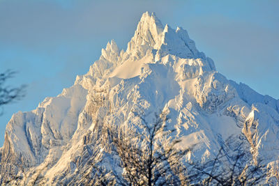 Scenic view of snowcapped mountains against clear sky