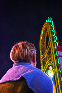 Rear view of woman in amusement park