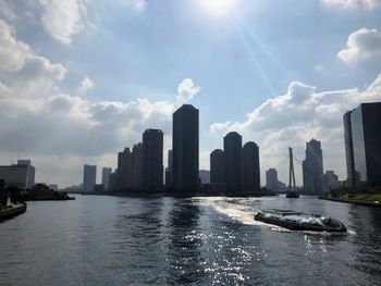 Panoramic view of modern buildings in city against sky