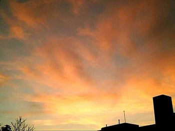 Low angle view of dramatic sky during sunset