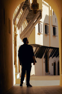 Rear view of woman walking on street