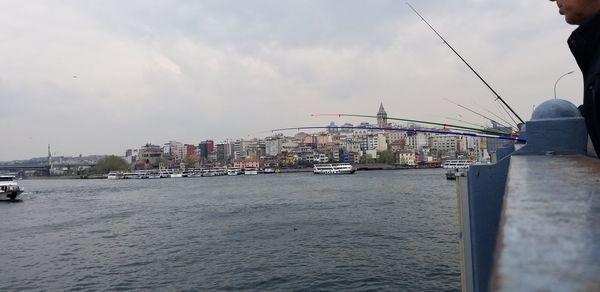 View of sea and buildings against sky