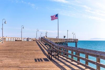 Pier over sea against sky