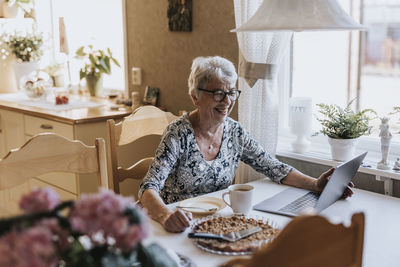 Senior woman using laptop