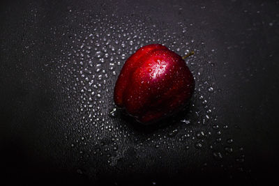 Close-up of wet apple on table