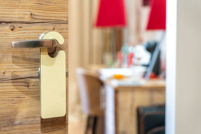 Close-up of telephone booth on table at home