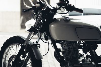 Close-up of motorcycle on street
