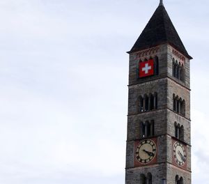 Low angle view of clock tower against sky