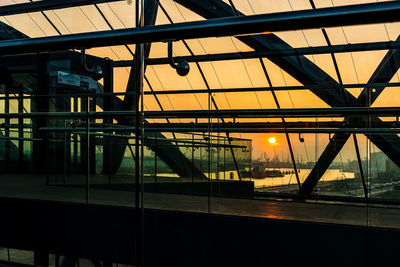 Reflection of bridge on glass window